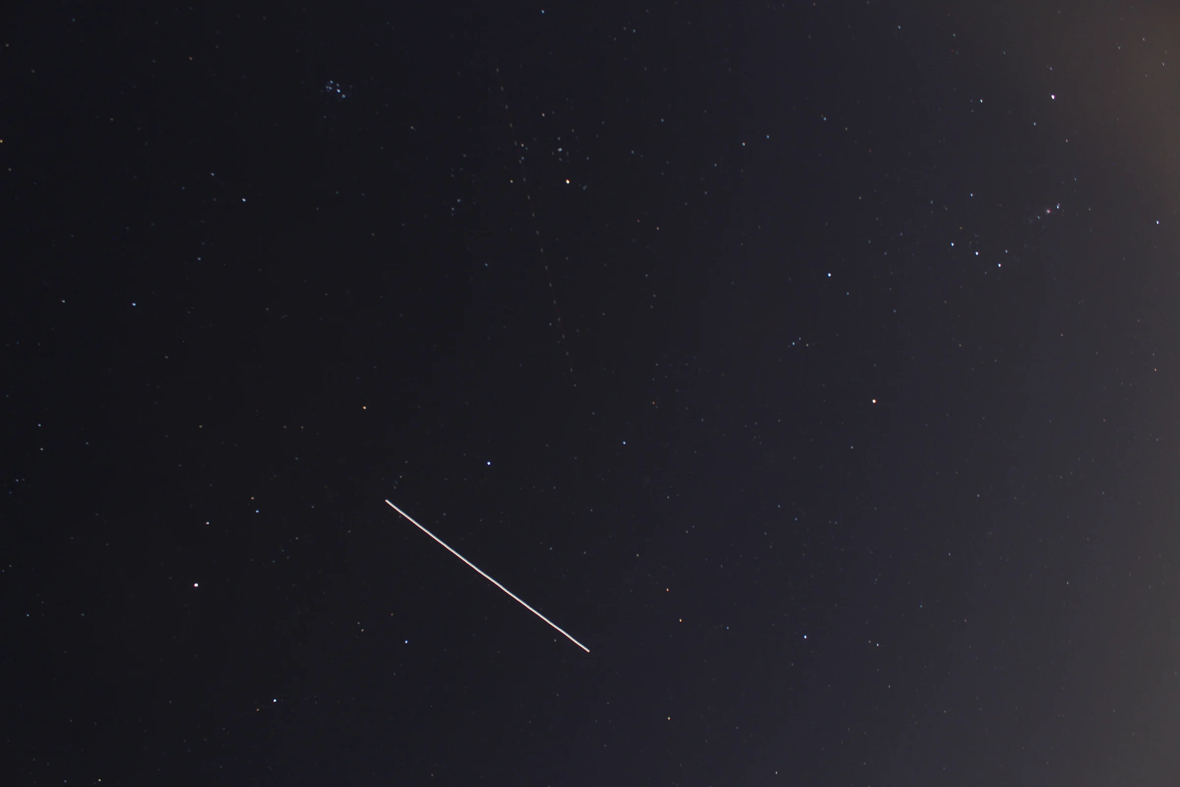ISS captured next to Orion and Pleiades