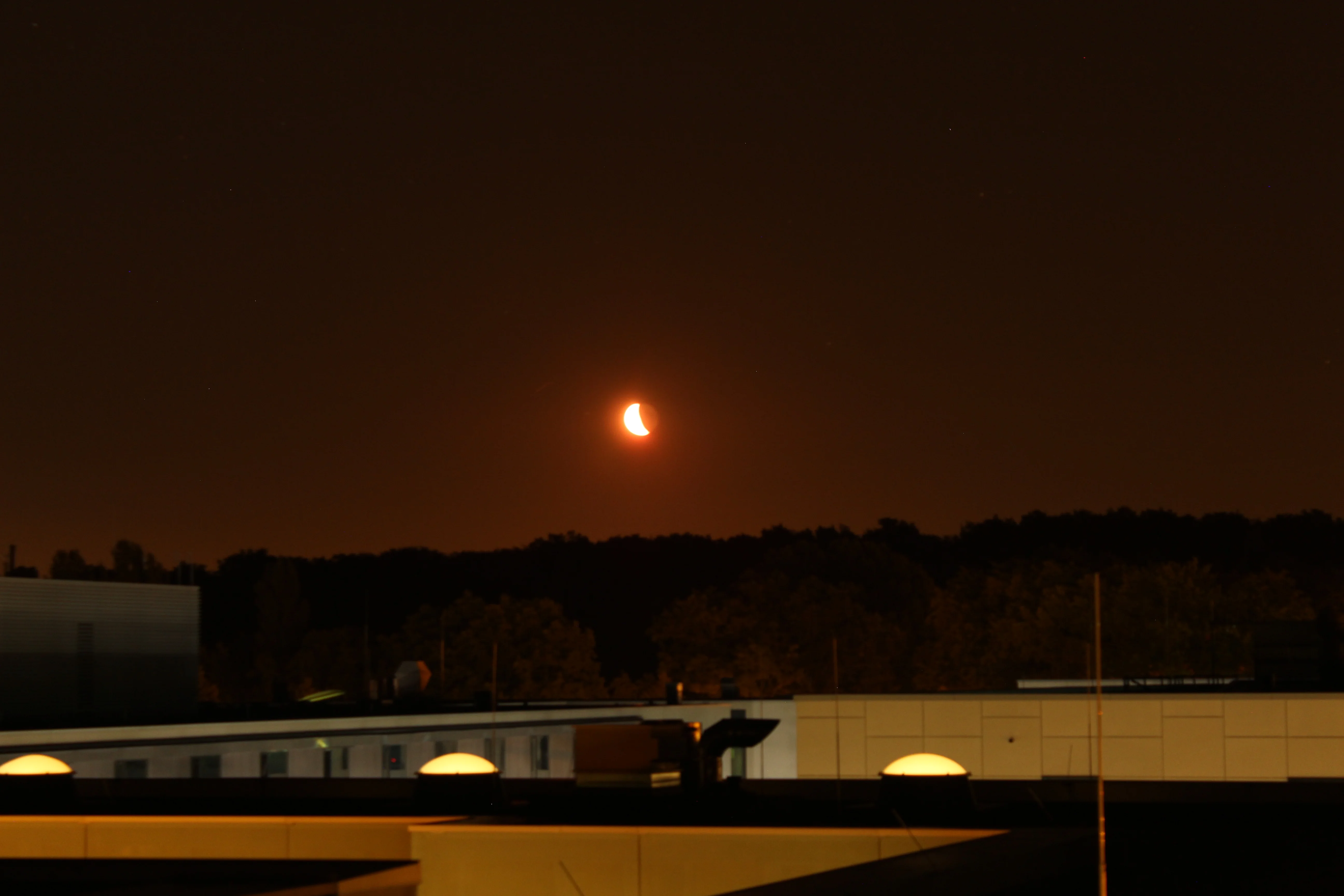 Crescent moon on the horizon with earthshine