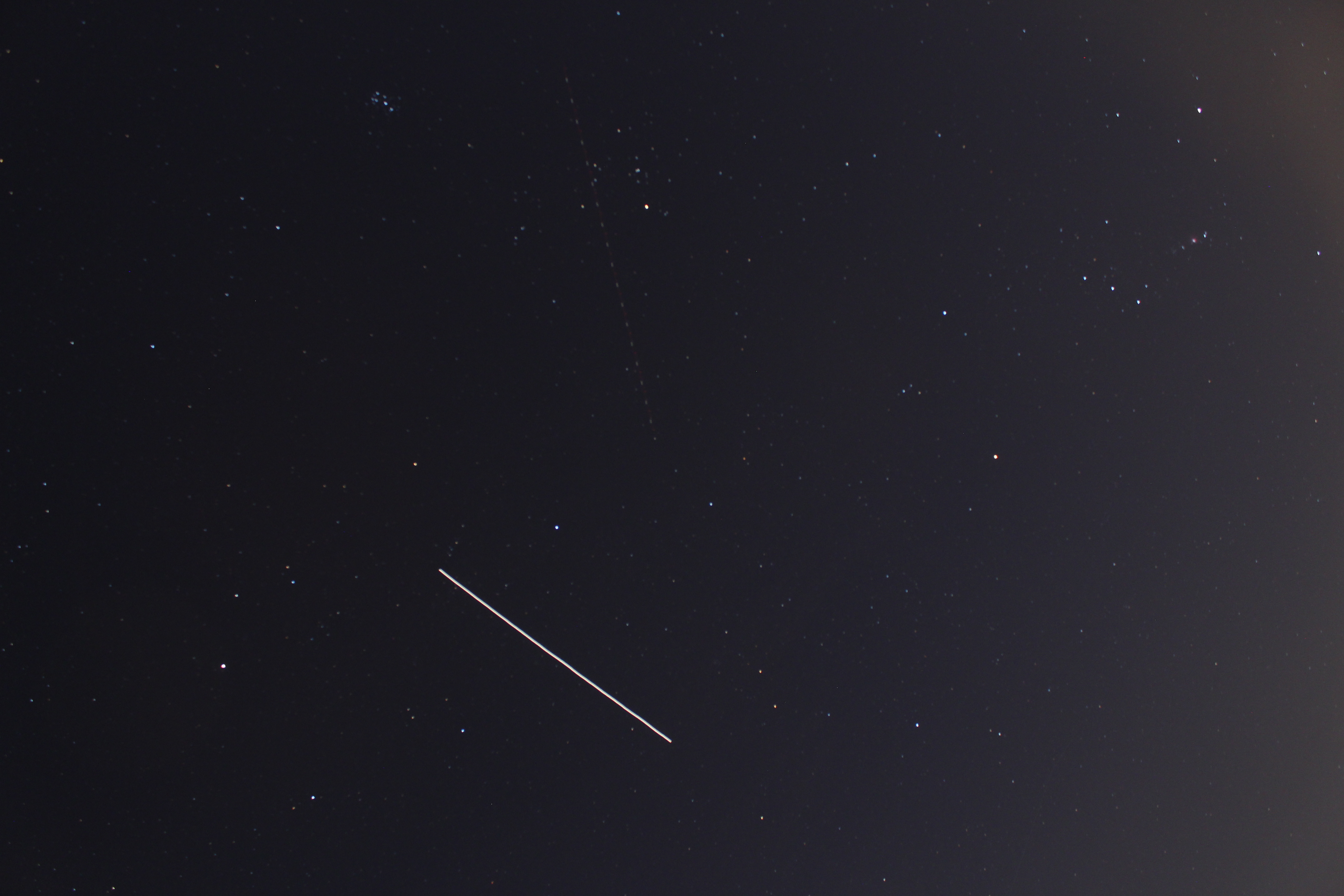 ISS captured next to Orion and Pleiades
