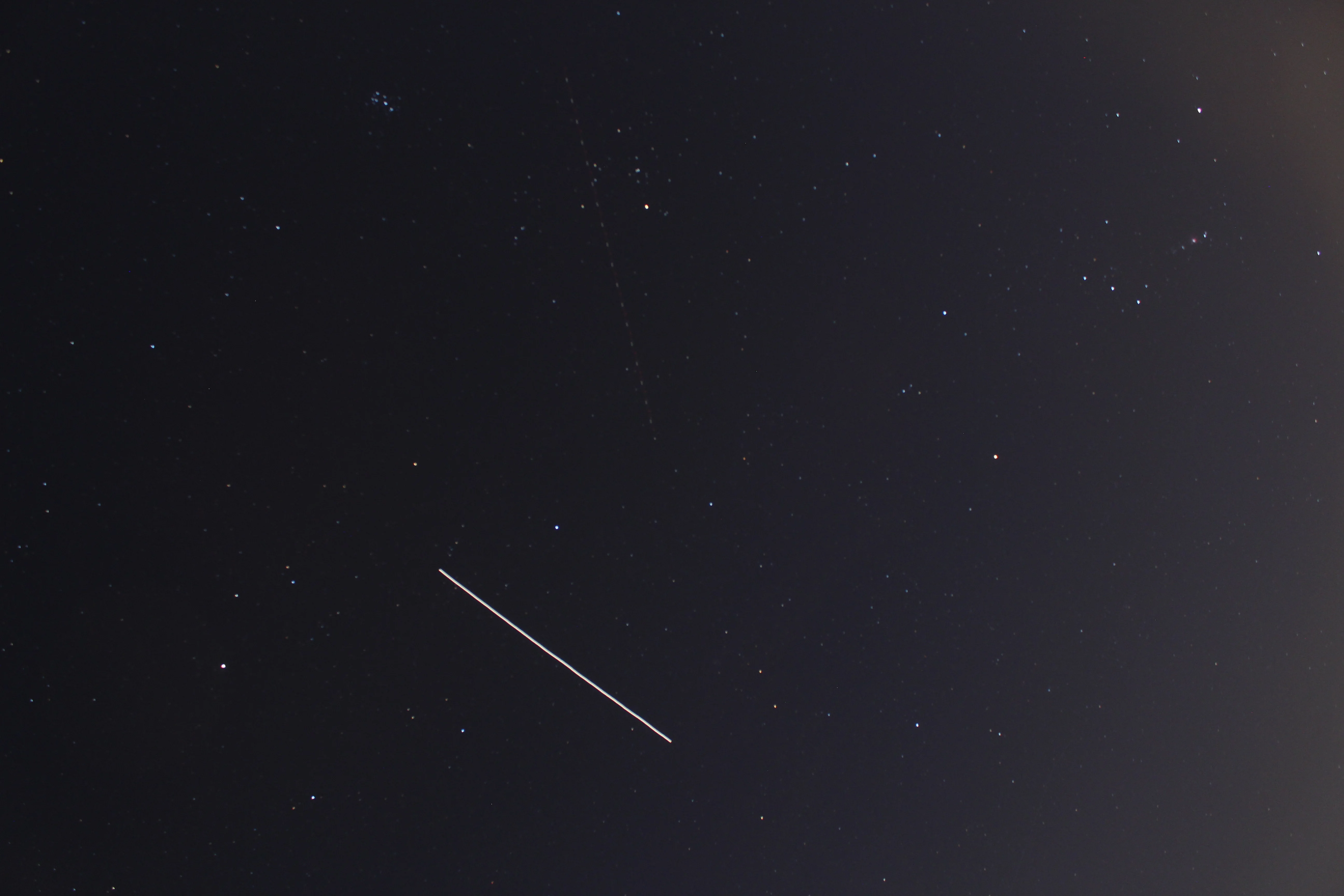 ISS captured next to Orion and Pleiades