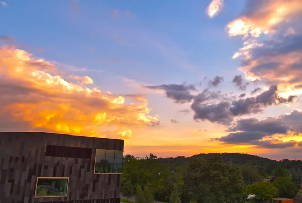 Library with cloudy sky