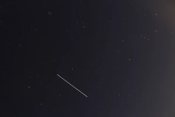 ISS captured next to Orion and Pleiades
